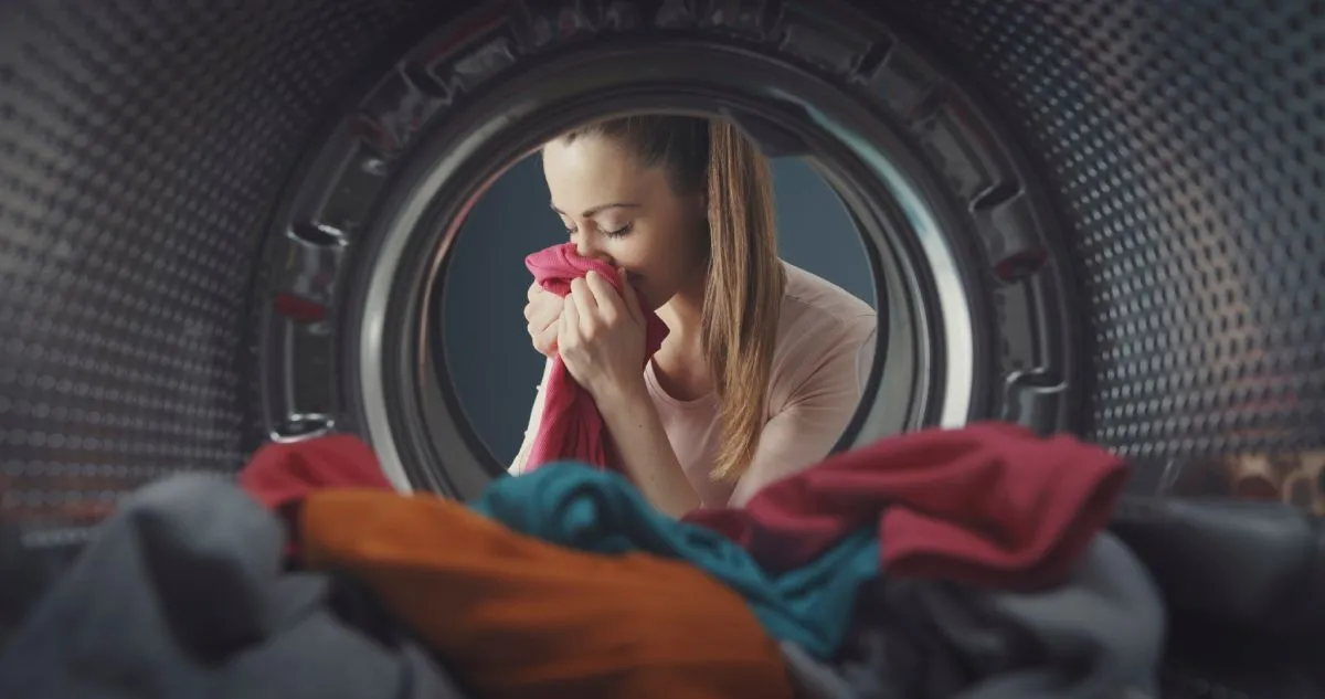 Happy,Woman,Smelling,Her,Freshly,Washed,Laundry,,Point,Of,View