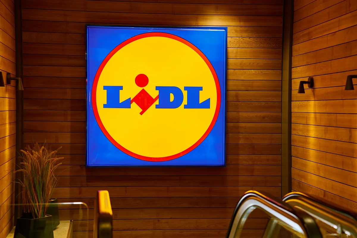 Illuminated,Lidl,Logo,Inside,Store,With,Wooden,Wall,Panels.,German