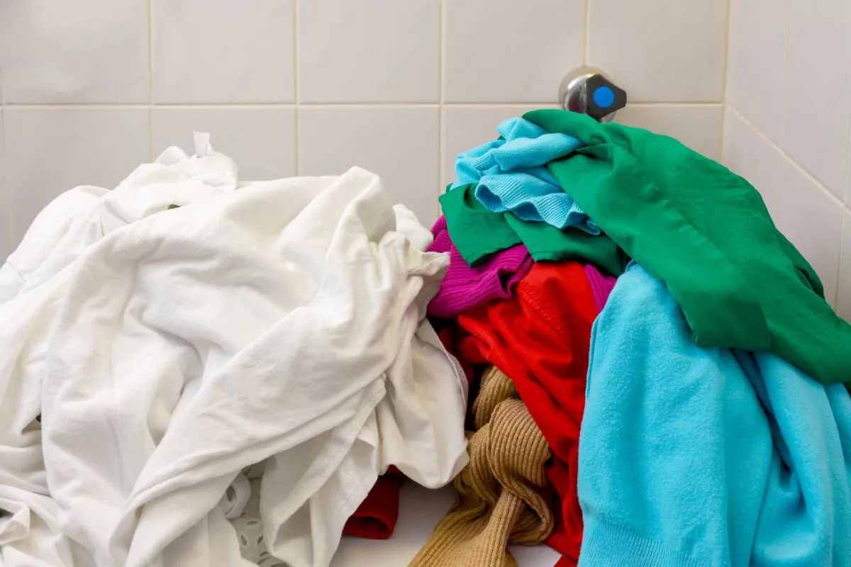 Pile,Of,White,And,Colors,Clothes,Being,Separate,Before,Load