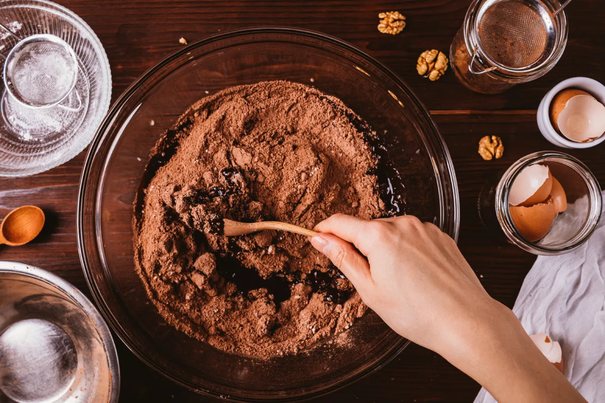 Mixing,Melted,Chocolate,And,Cocoa,Powder,In,Large,Bowl,To