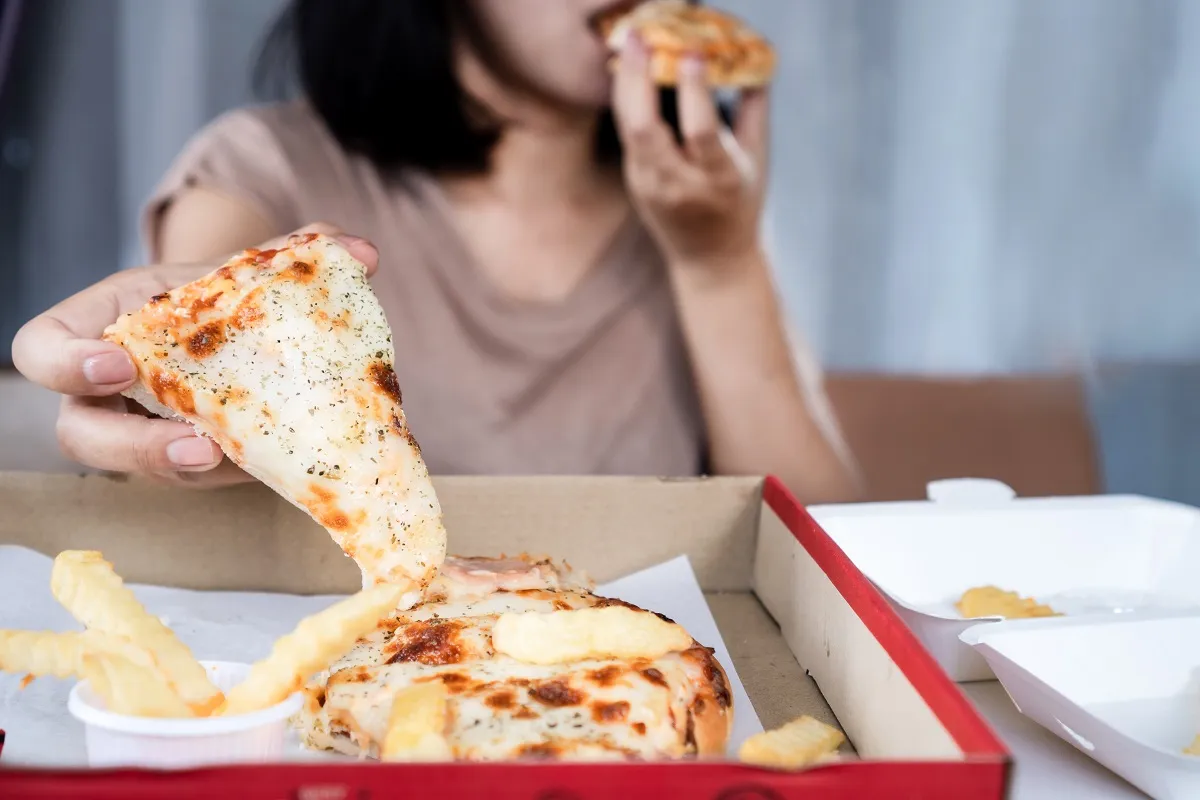 Binge,Eating,Disorder,Concept,With,Woman,Over,Eating,Fast,Food